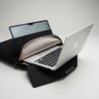 Laptop entering a protective Faraday sleeve